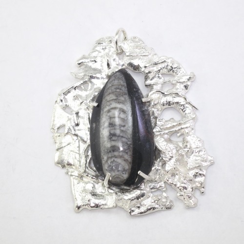 Fused silver pendant with fossil